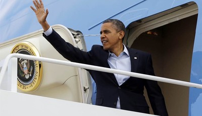 
              President Barack Obama waves as he boards Air Force One before his departure from Andrews Air Force Base, Sunday, Nov. 4, 2012. Just two days from the finish, Obama